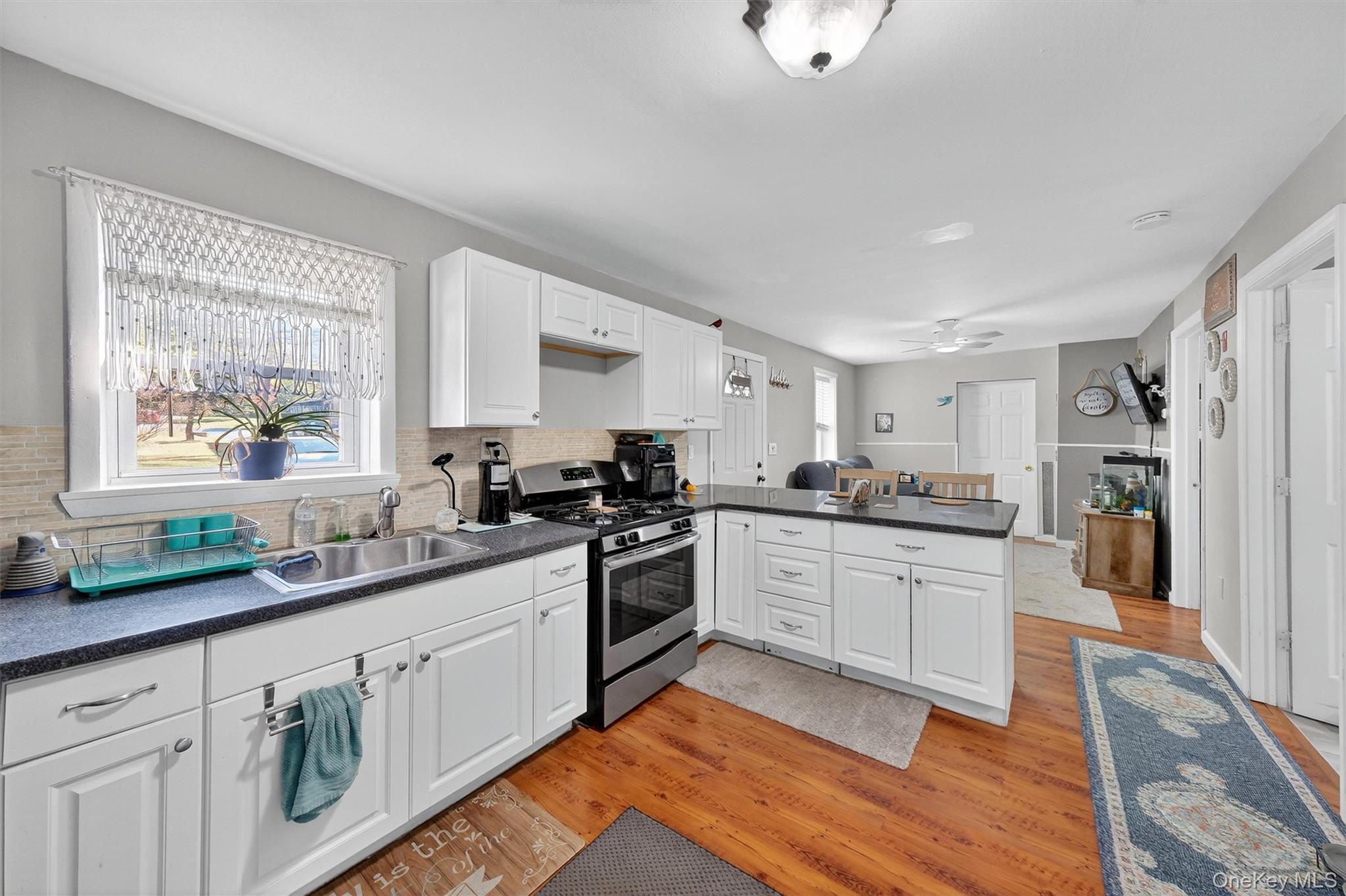 27 Peckham Road Poughkeepsie, NY 12603 - Photo 13 of 27 a kitchen with stainless steel appliances granite countertop a sink stove and refrigerator