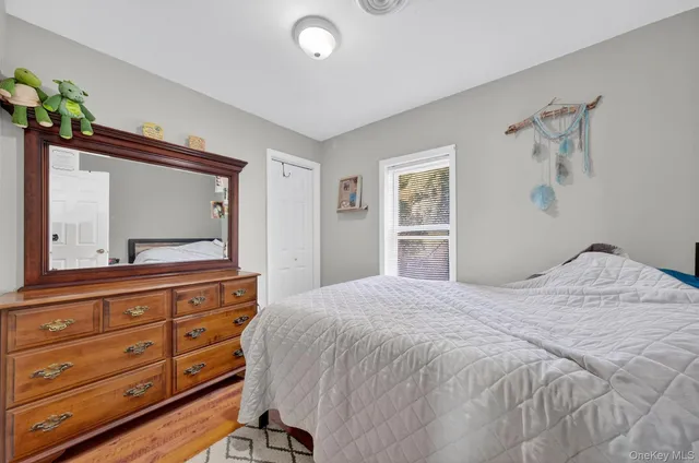 a bedroom with a bed and a dresser