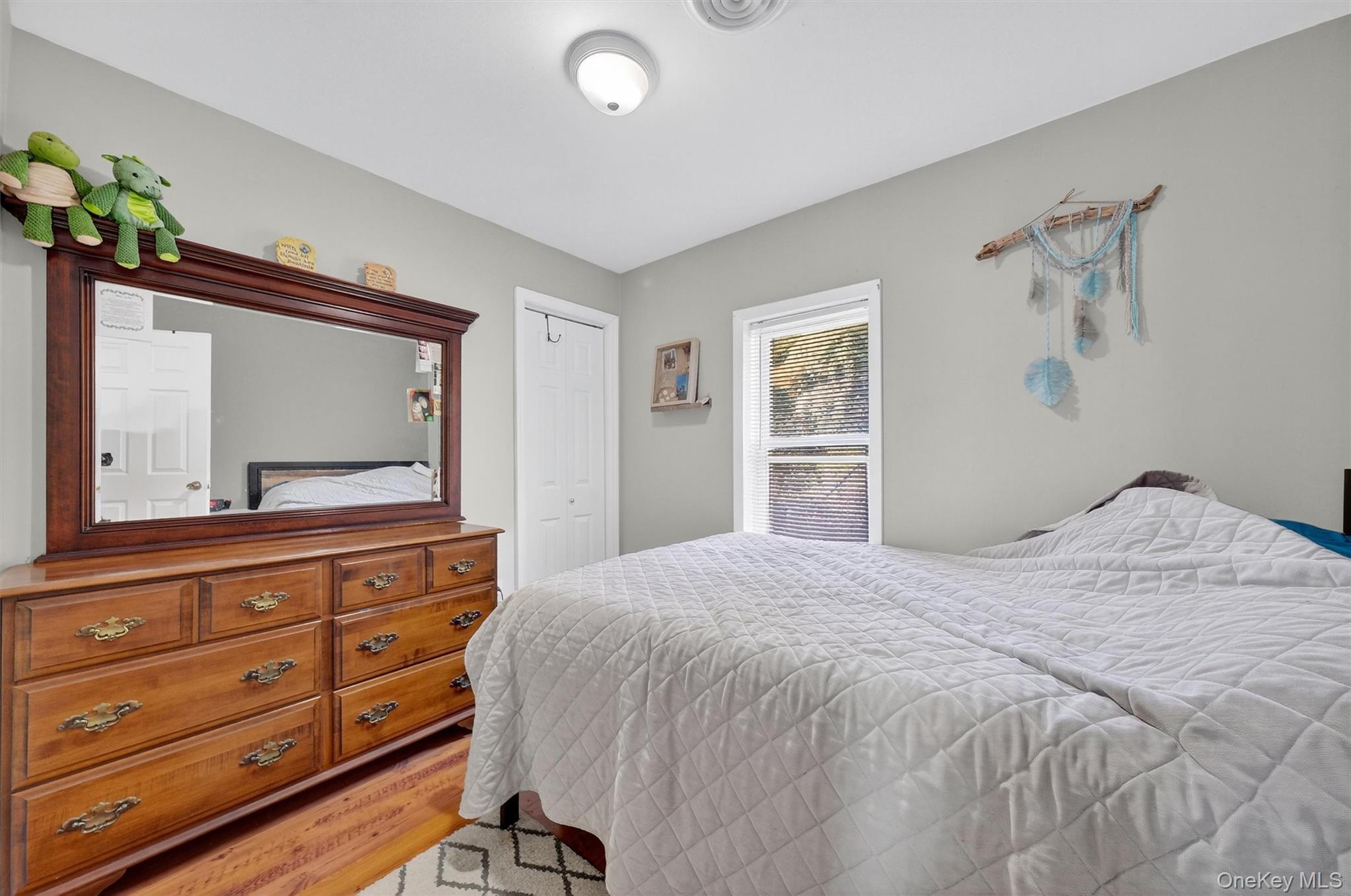 27 Peckham Road Poughkeepsie, NY 12603 - Photo 17 of 27 a bedroom with a bed and a dresser