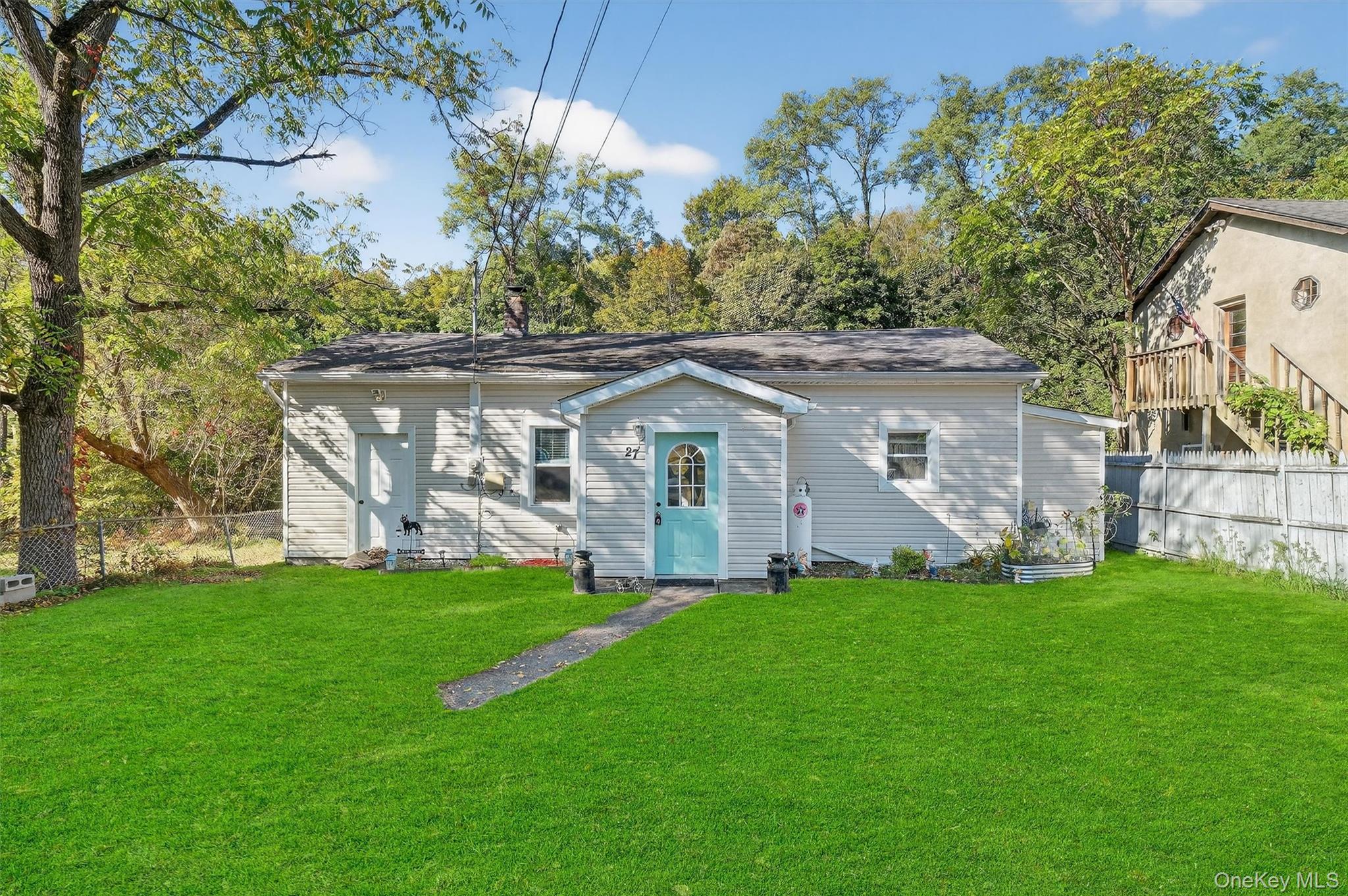 27 Peckham Road Poughkeepsie, NY 12603 - Photo 4 of 27 a front view of a house with a garden