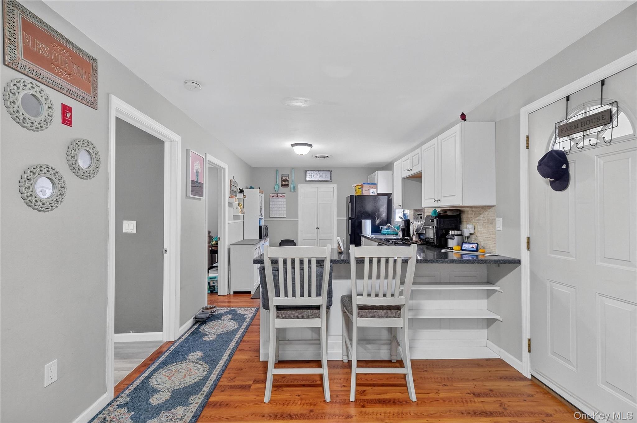 27 Peckham Road Poughkeepsie, NY 12603 - Photo 8 of 27 a view of kitchen and dining area with wooden floor