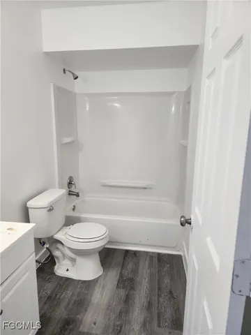a bathroom with a toilet a sink and bathtub