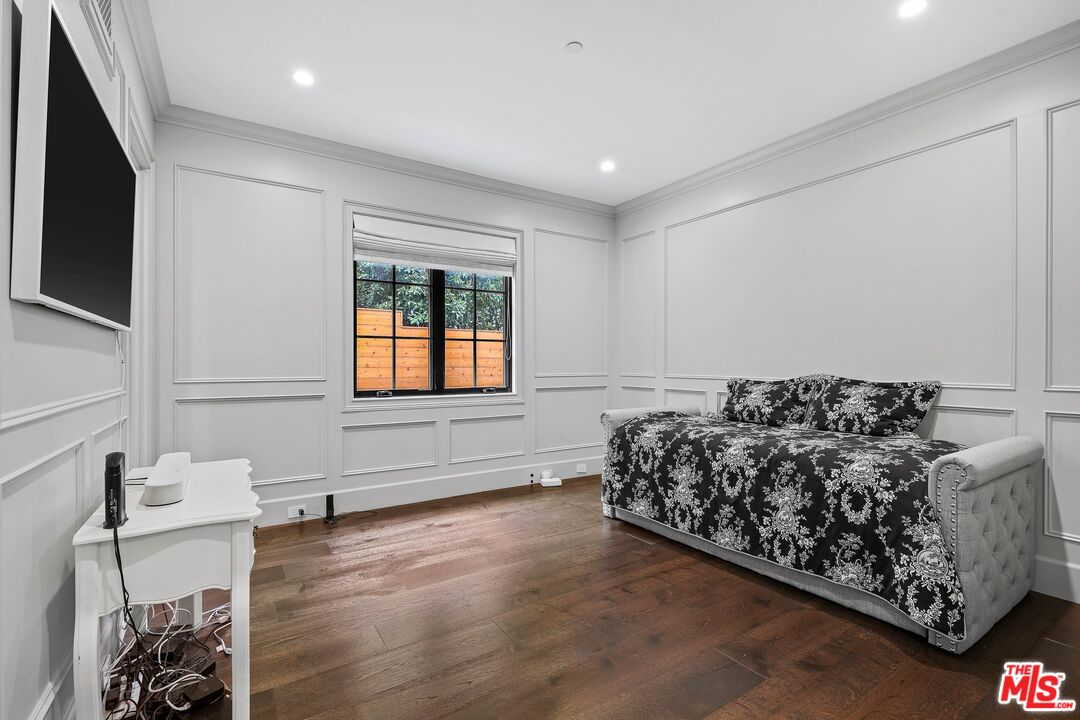 9348 Cresta Drive Los Angeles, CA 90035 - Photo 16 of 44 a bed sitting in a room next to a window