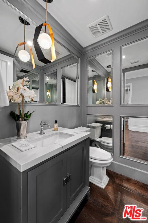 9348 Cresta Drive Los Angeles, CA 90035 - Photo 17 of 44 a bathroom with a toilet sink and mirror