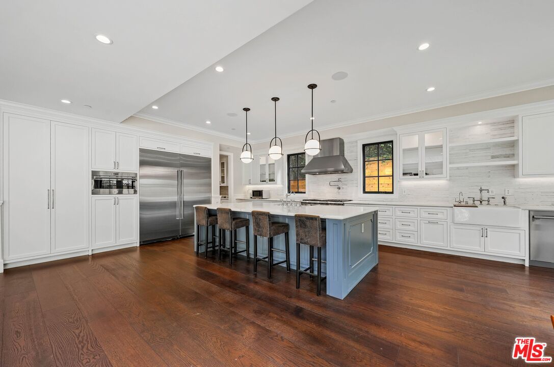 9348 Cresta Drive Los Angeles, CA 90035 - Photo 22 of 44 a large kitchen with lots of counter space and stainless steel appliances