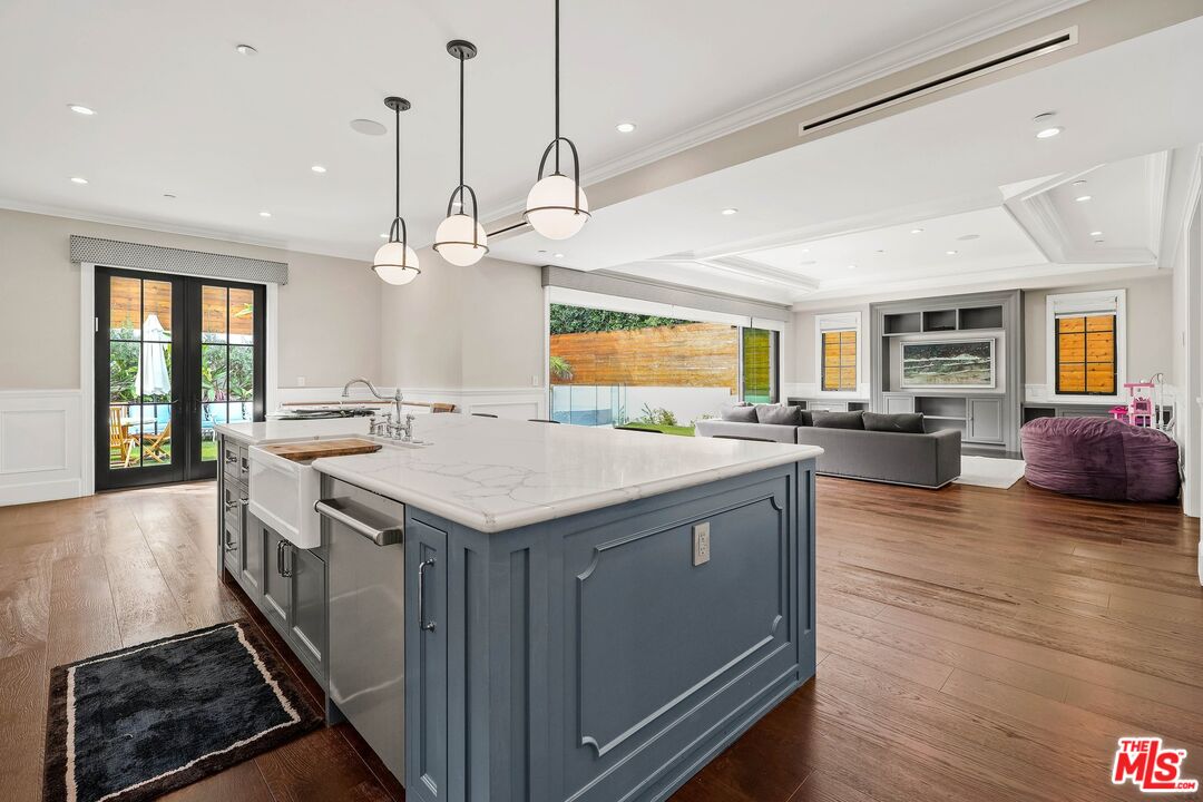 9348 Cresta Drive Los Angeles, CA 90035 - Photo 24 of 44 a kitchen with a stove and a wooden floor