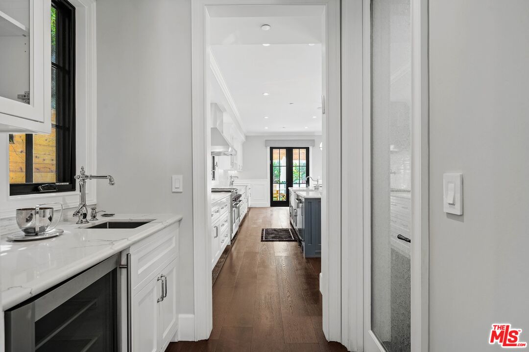9348 Cresta Drive Los Angeles, CA 90035 - Photo 25 of 44 a bathroom with a sink and a mirror