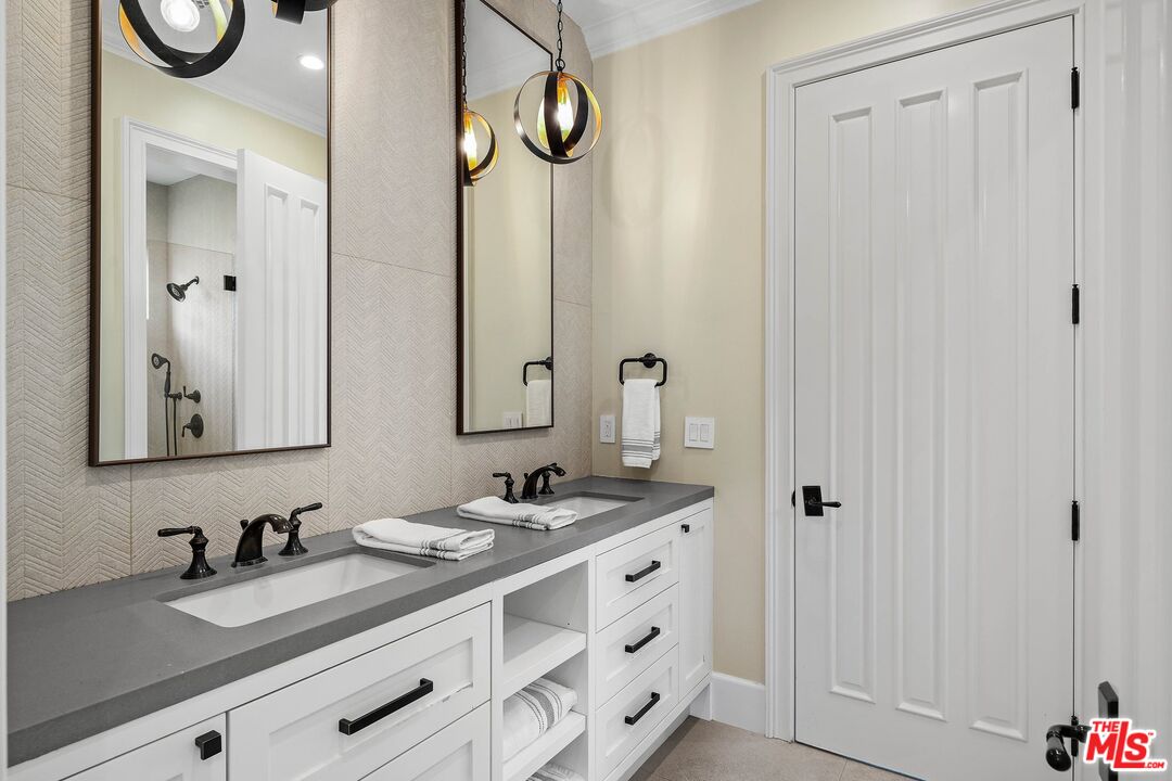 9348 Cresta Drive Los Angeles, CA 90035 - Photo 36 of 44 a bathroom with a sink vanity and a mirror