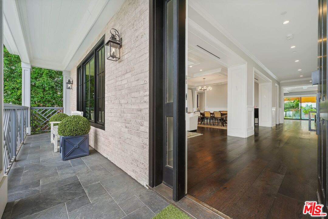 9348 Cresta Drive Los Angeles, CA 90035 - Photo 4 of 44 a view of an entryway of a house and floor to ceiling window