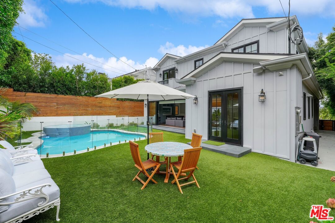 9348 Cresta Drive Los Angeles, CA 90035 - Photo 42 of 44 a view of a house with a yard porch and sitting area