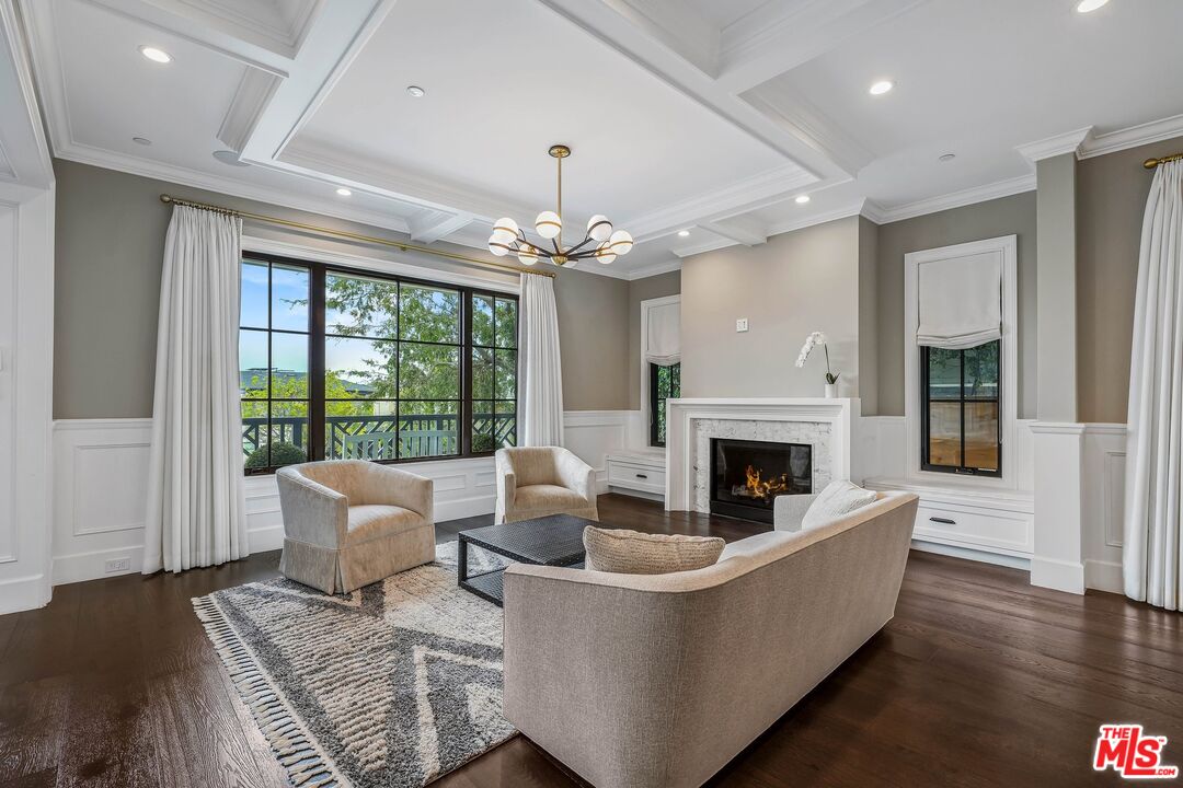 9348 Cresta Drive Los Angeles, CA 90035 - Photo 6 of 44 a living room with furniture large window and fireplace