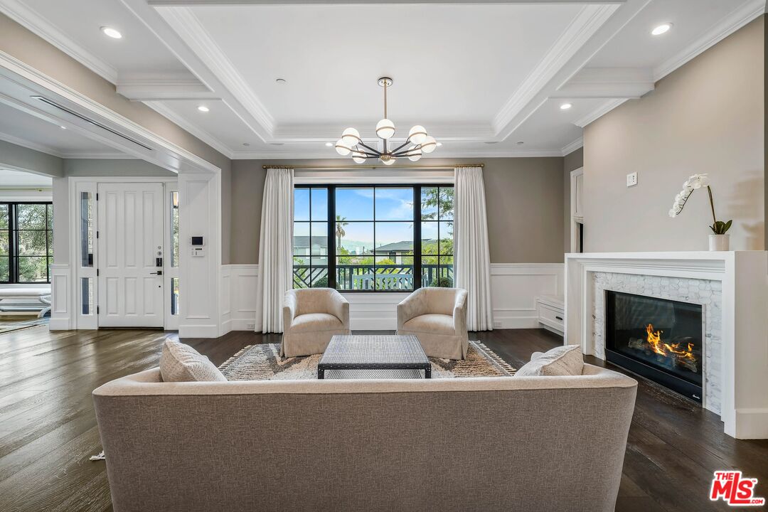 9348 Cresta Drive Los Angeles, CA 90035 - Photo 7 of 44 a living room with furniture large window and fireplace
