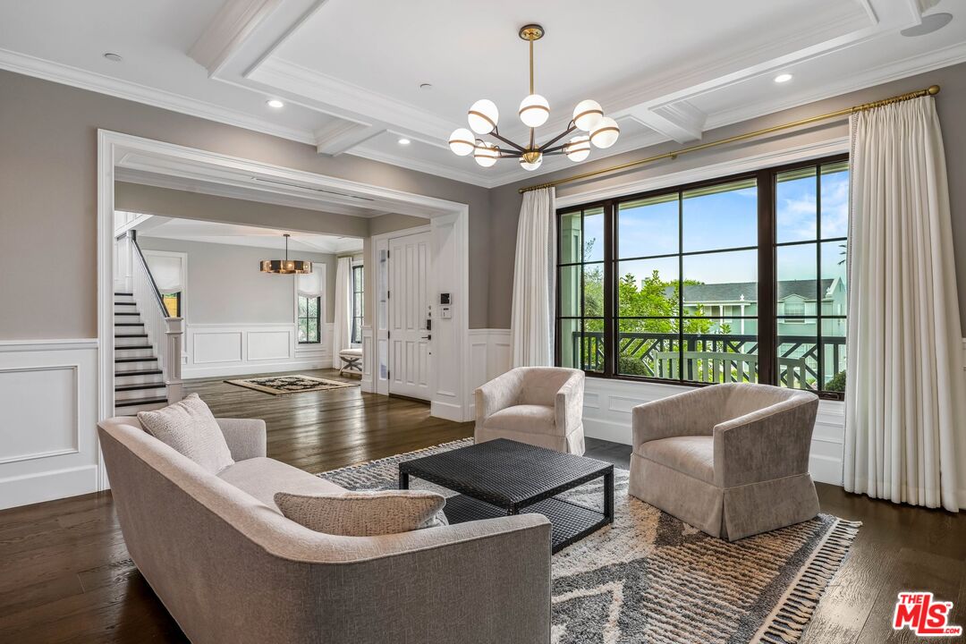 9348 Cresta Drive Los Angeles, CA 90035 - Photo 8 of 44 a living room with furniture and a chandelier