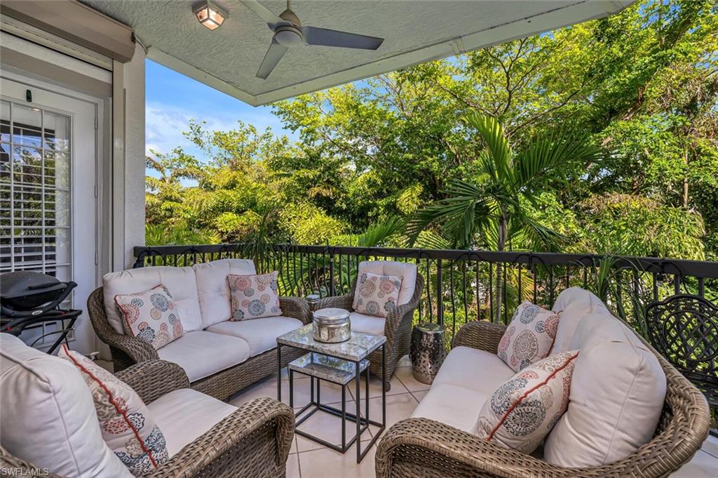 705 10th Street South, Unit 202 Naples, FL 34102 - Photo 13 of 17 a balcony with wooden floor