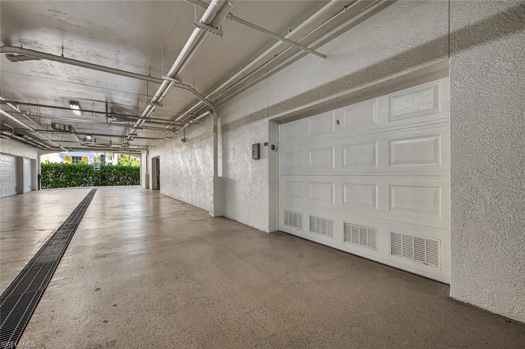 705 10th Street South, Unit 202 Naples, FL 34102 - Photo 14 of 17 a view of a garage