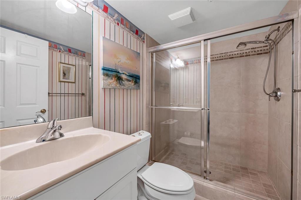 705 10th Street South, Unit 202 Naples, FL 34102 - Photo 17 of 17 a bathroom with a sink toilet and shower