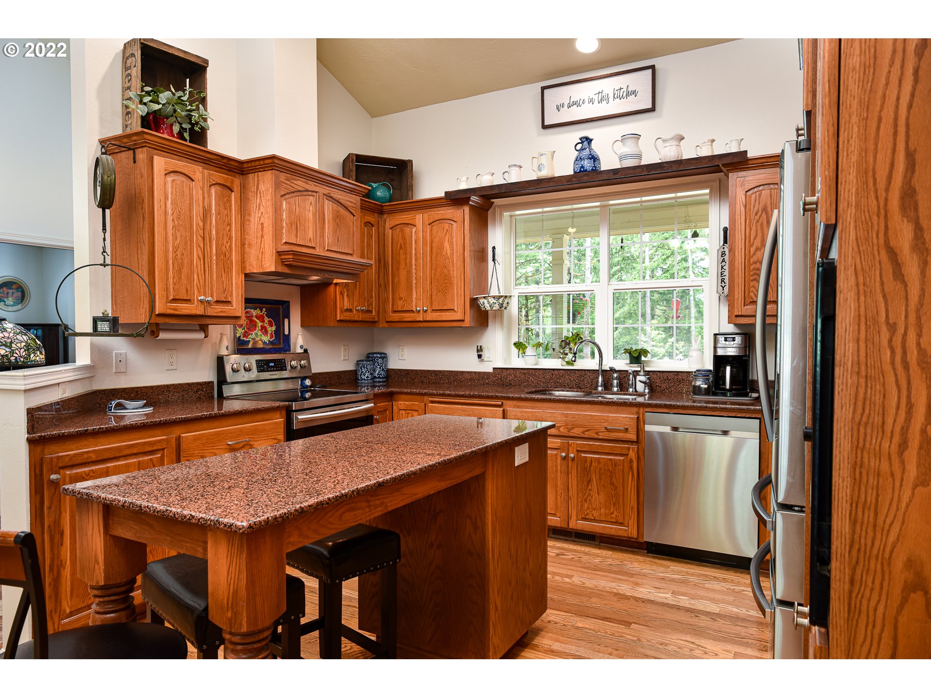 40156 Booth Kelly Road Springfield, OR 97478 - Photo 3 of 31 a kitchen with stainless steel appliances granite countertop a stove a sink dishwasher and a refrigerator