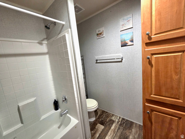 597 North State Street, Unit 67 Orem, UT 84057 - Photo 18 of 23 Full bathroom with dark wood finished floors and shower / bathtub combination