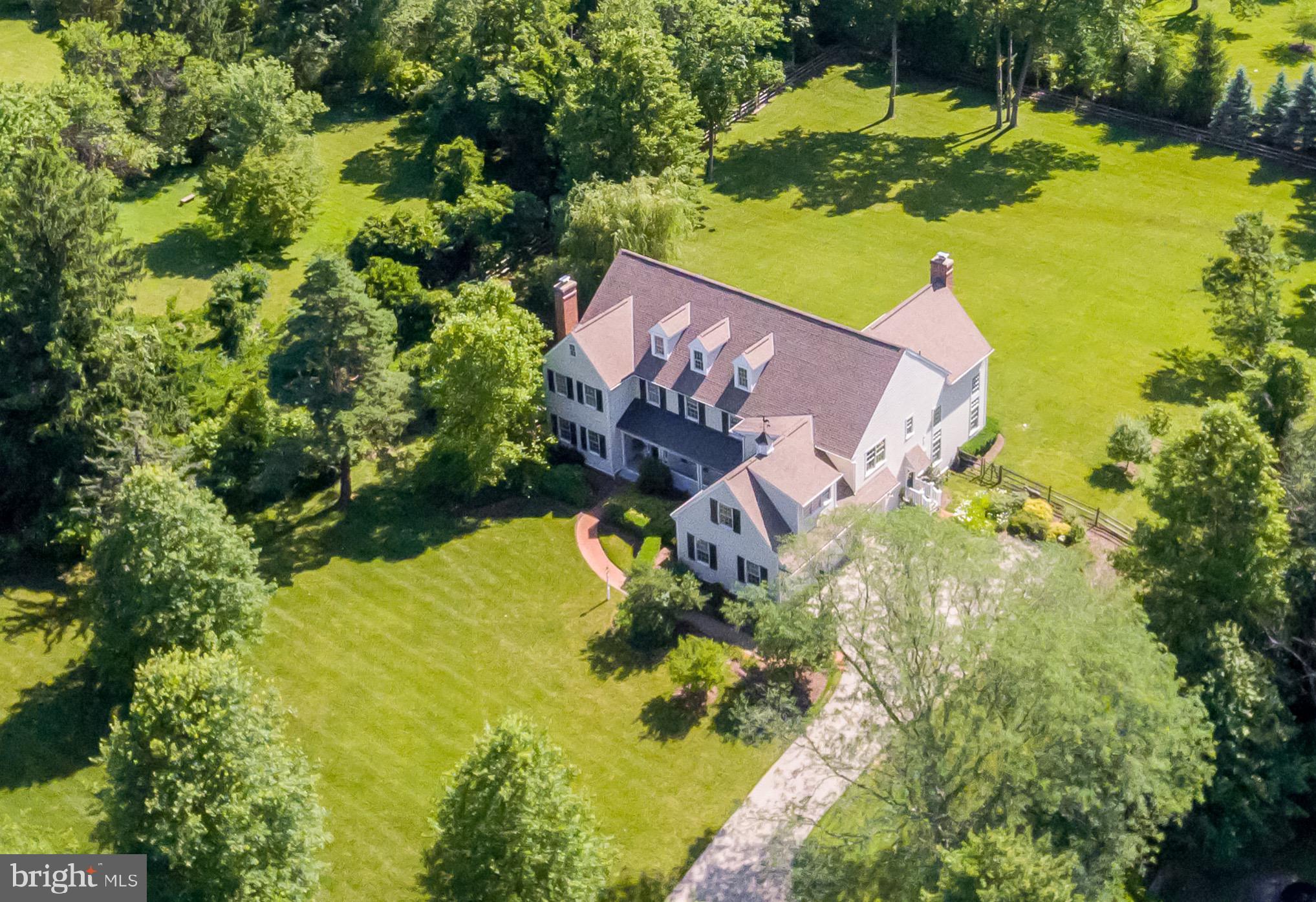 904 Plymouth Road Lower Gwynedd, PA 19002 - Photo 41 of 44 an aerial view of a house with a yard swimming pool outdoor seating and yard