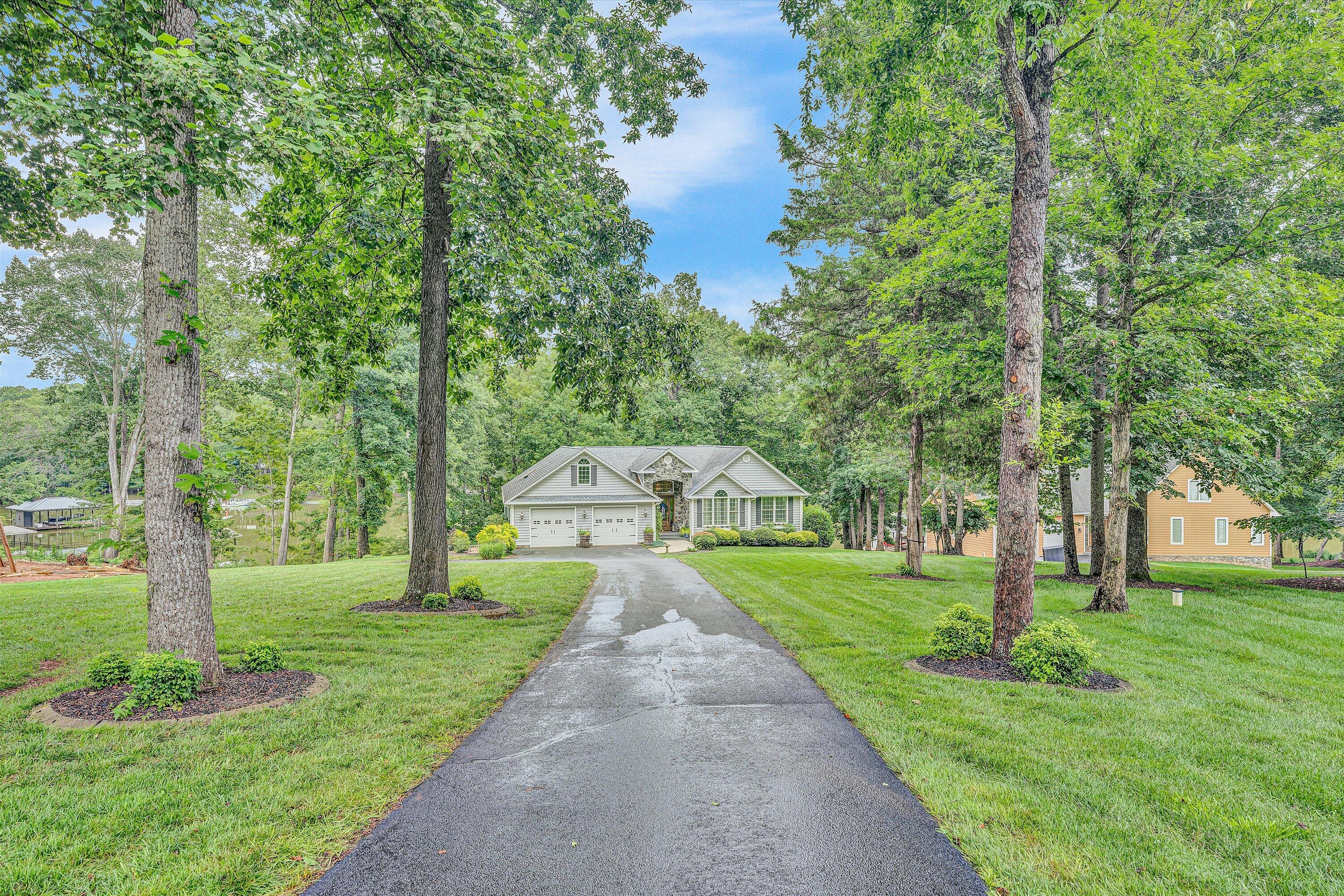 239 Cedar Bay Road Union Hall, VA 24176 - Photo 44 of 51 a view of a park with large trees and a fountain