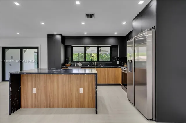 a large bathroom with a large tub and sink