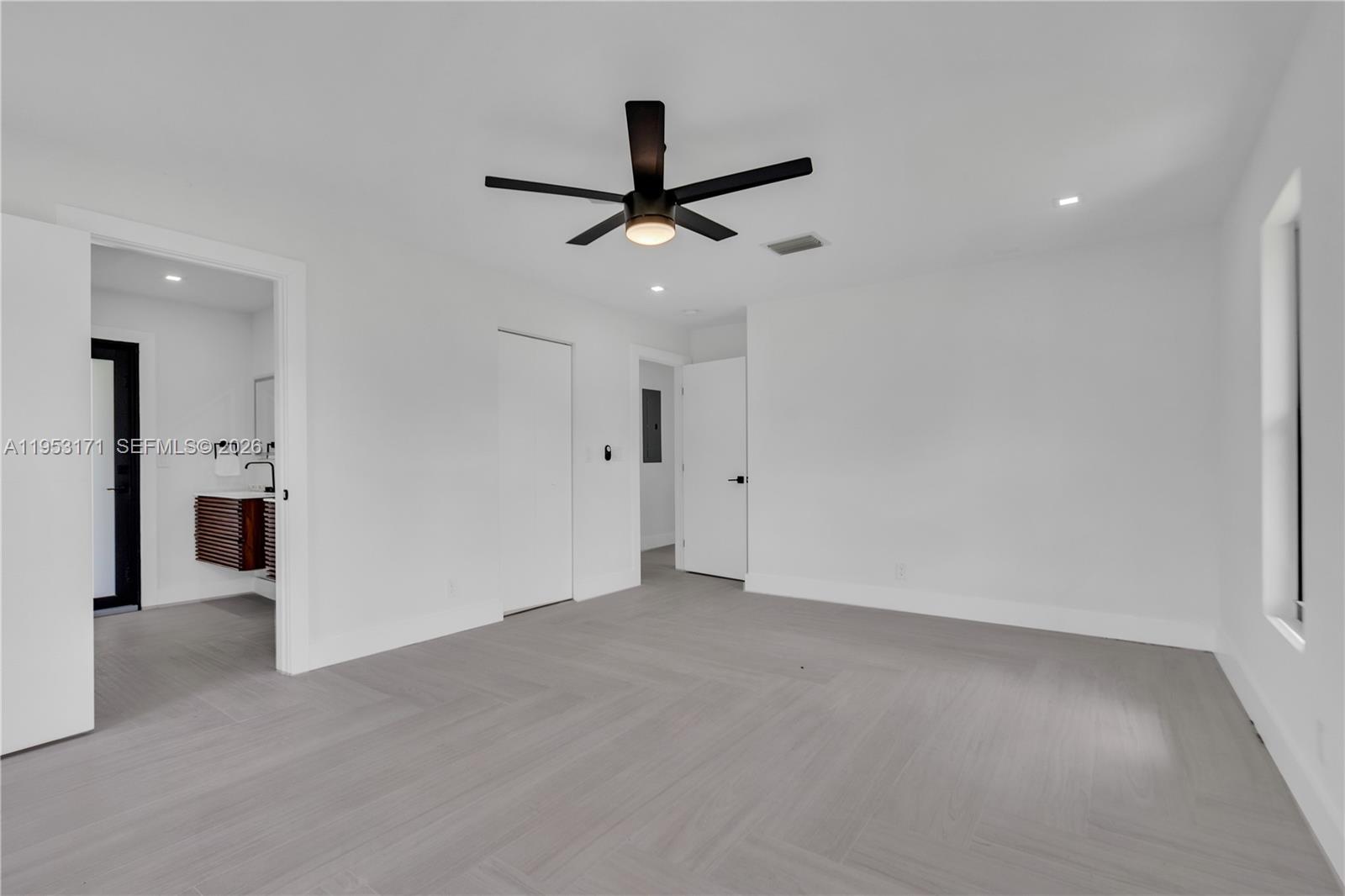 17680 Southwest 54th Street Southwest Ranches, FL 33331 - Photo 17 of 40 an empty room with closet and a ceiling fan