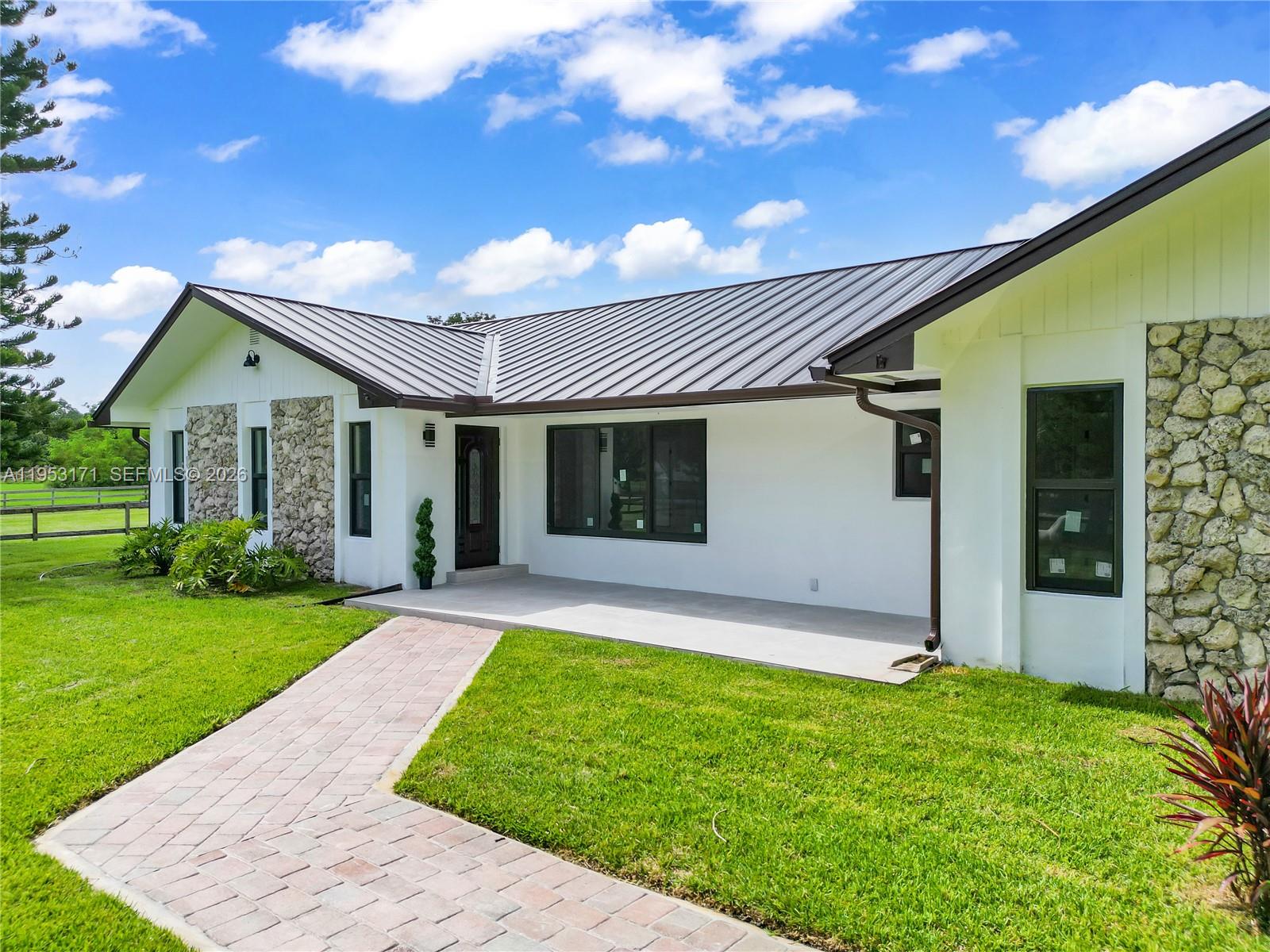 17680 Southwest 54th Street Southwest Ranches, FL 33331 - Photo 2 of 40 front view of a house with a yard
