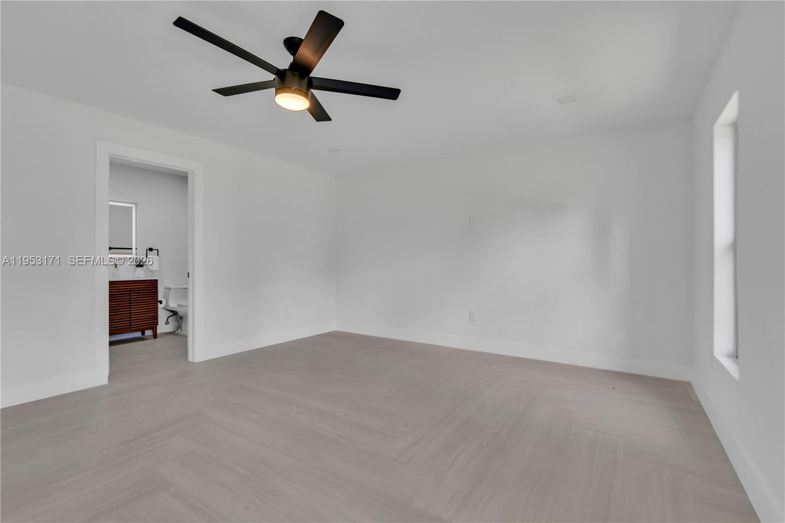 17680 Southwest 54th Street Southwest Ranches, FL 33331 - Photo 26 of 40 an empty room with closet and a ceiling fan