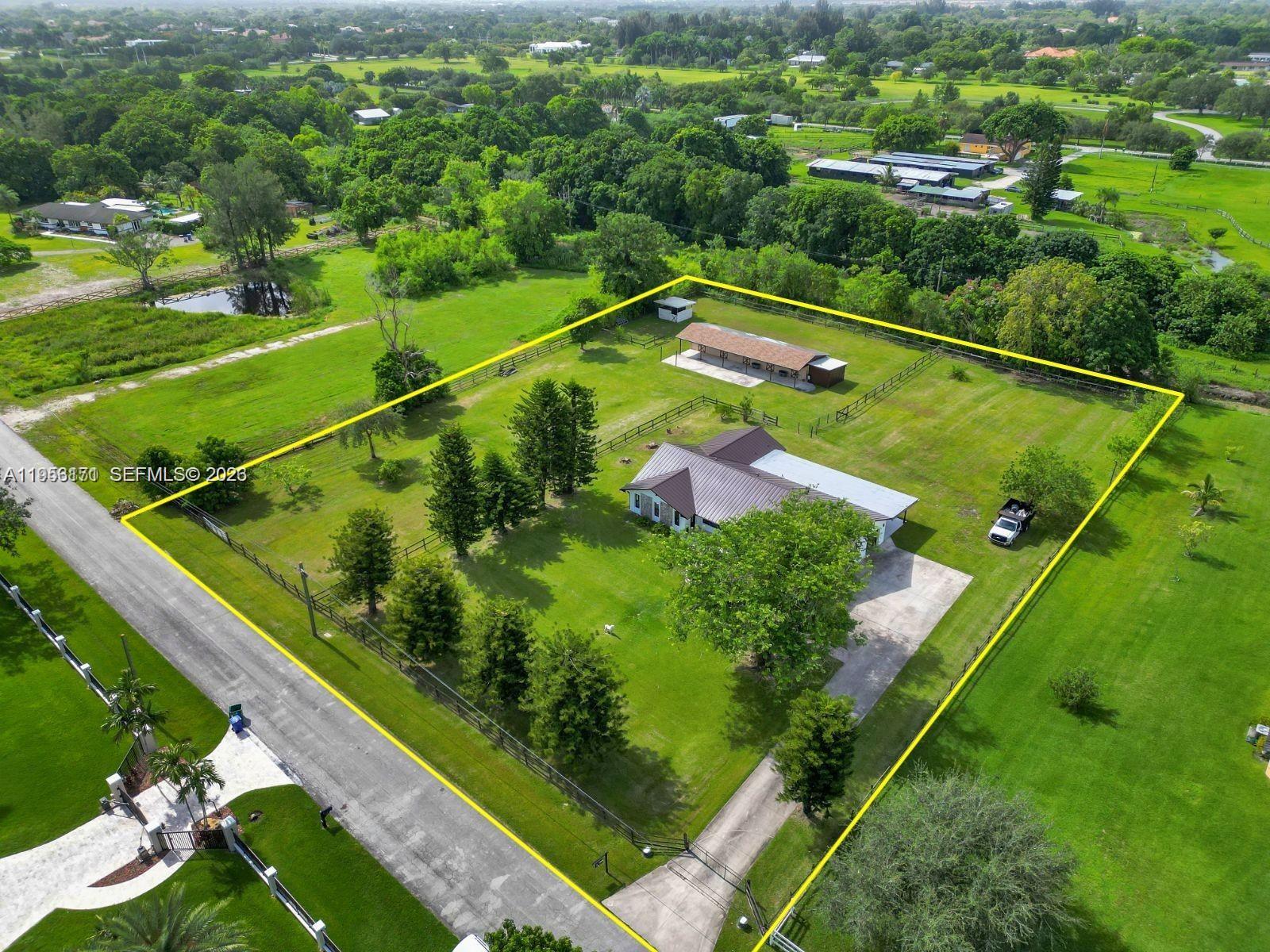 17680 Southwest 54th Street Southwest Ranches, FL 33331 - Photo 3 of 40 a view of a tennis court