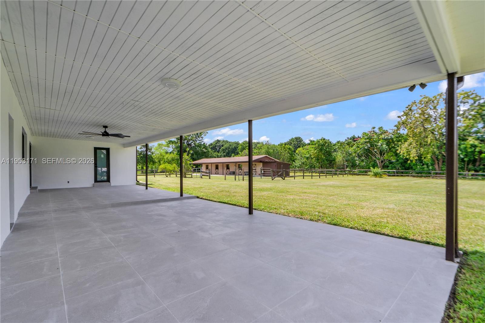 17680 Southwest 54th Street Southwest Ranches, FL 33331 - Photo 32 of 40 a view of a house with porch and garden