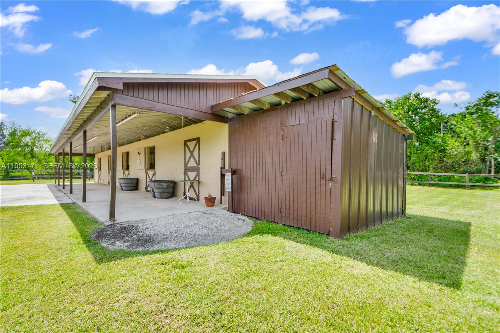 17680 Southwest 54th Street Southwest Ranches, FL 33331 - Photo 35 of 40 a view of a house with backyard and porch