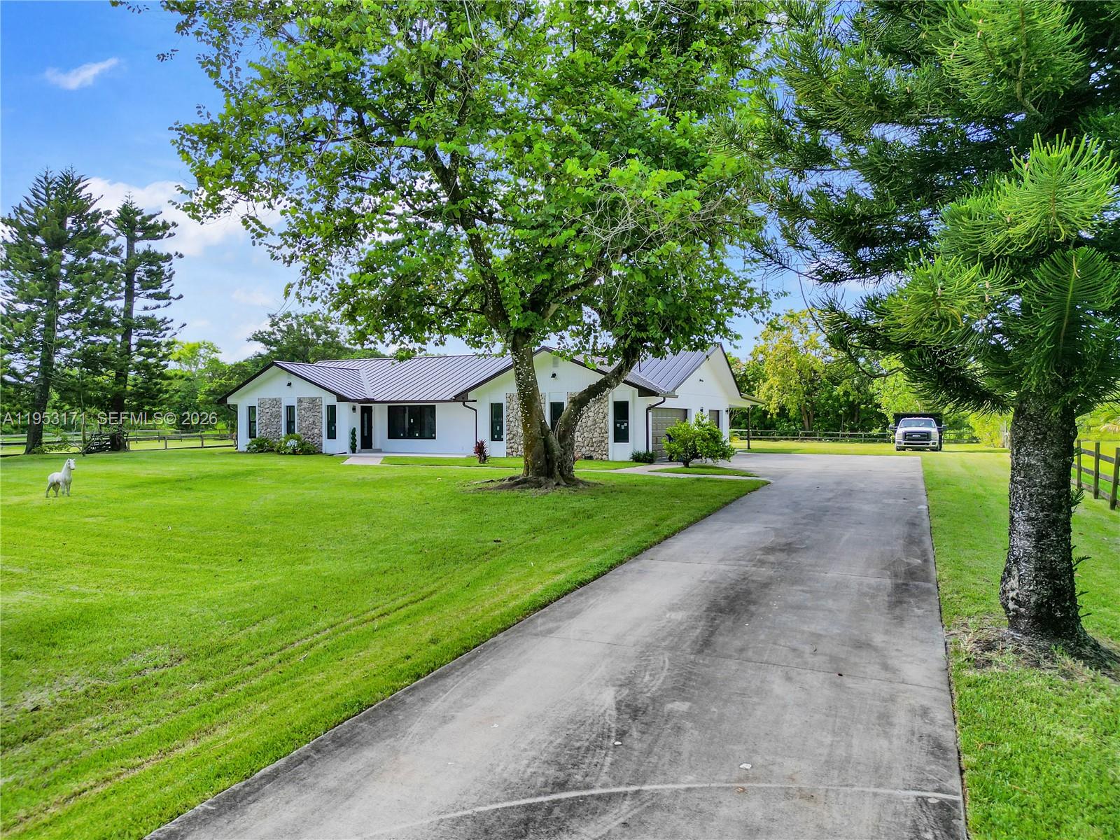 17680 Southwest 54th Street Southwest Ranches, FL 33331 - Photo 36 of 40 a view of a house with a yard