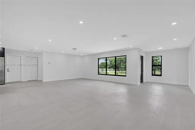 an empty room with windows