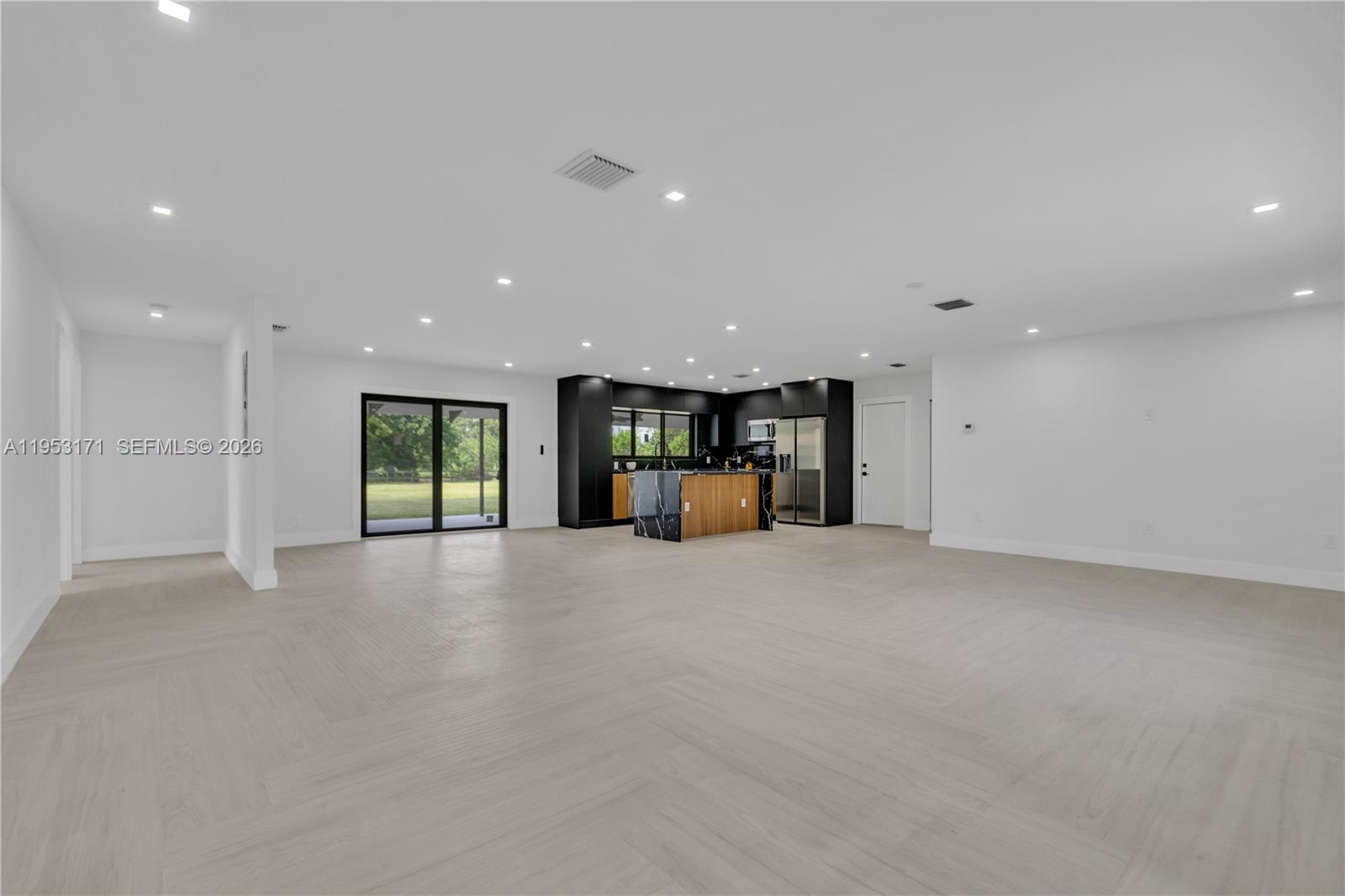 17680 Southwest 54th Street Southwest Ranches, FL 33331 - Photo 7 of 40 a view of empty room with kitchen and window