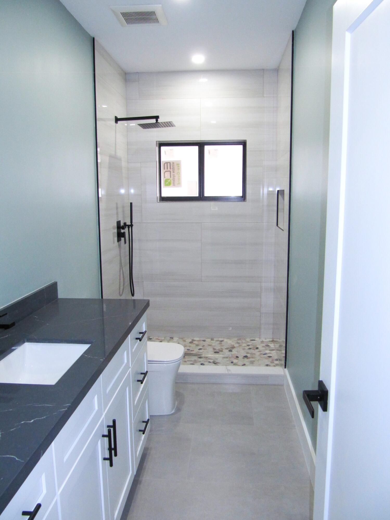 25 Abaco Road Key Largo, FL 33037 - Photo 13 of 17 a bathroom with a granite countertop sink toilet and shower