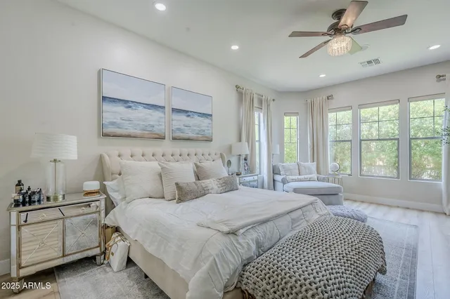 a bedroom with double bed and a window