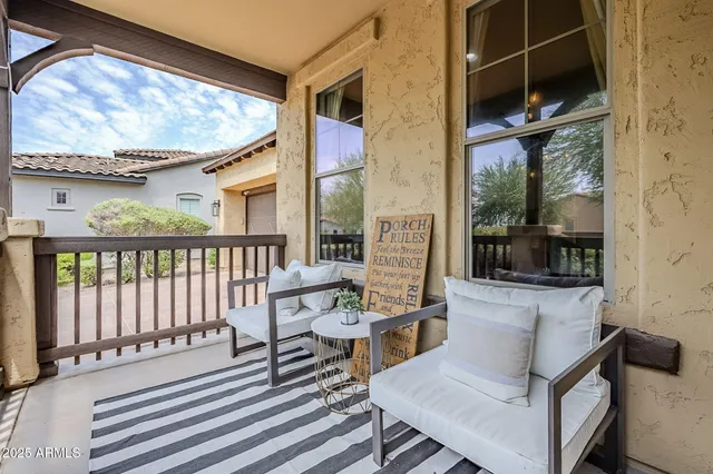 a view of a patio with a table and chairs