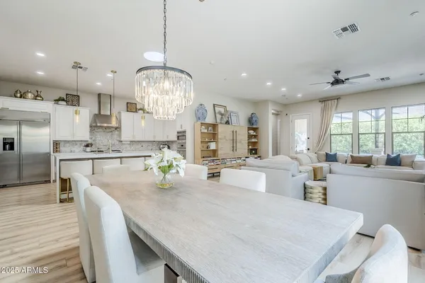 a large kitchen with kitchen island a large island in it