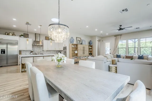 a large kitchen with kitchen island a large island in it