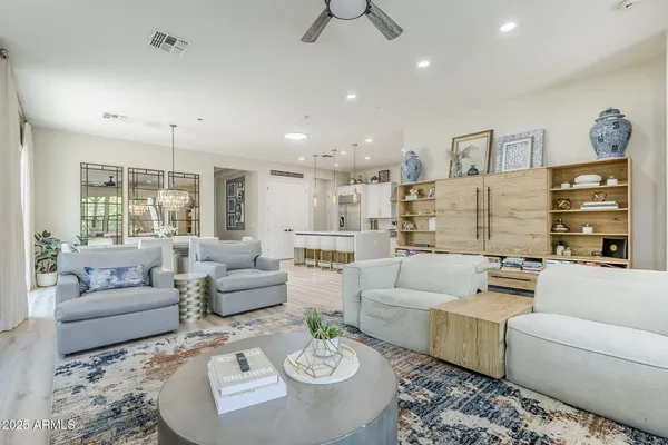 a living room with furniture and a large window