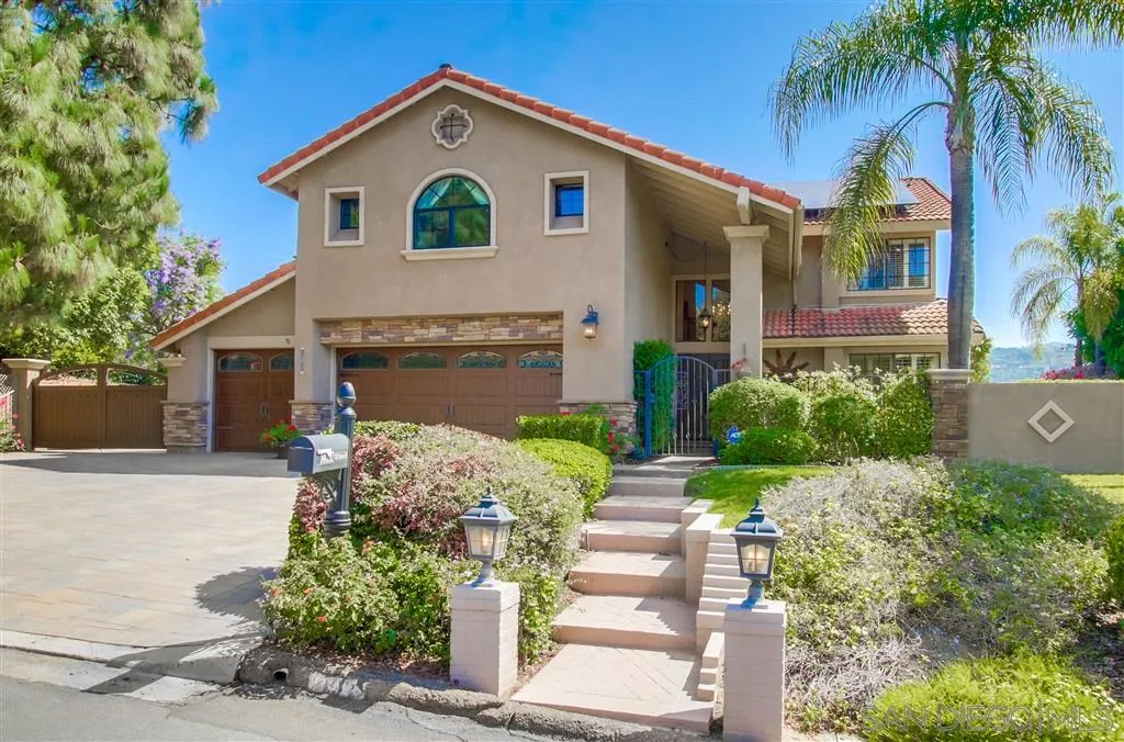 14032 Old Station Road Poway, CA 92064 - Photo 1 of 25 a front view of a house with a yard and garage