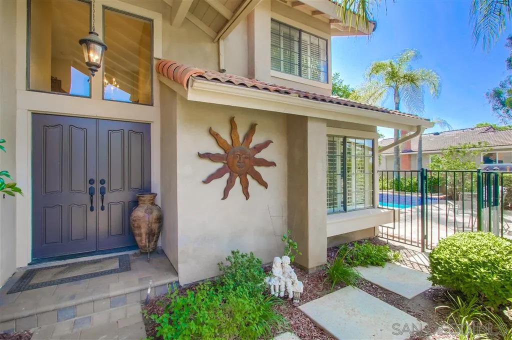 14032 Old Station Road Poway, CA 92064 - Photo 2 of 25 a front view of a house with a yard