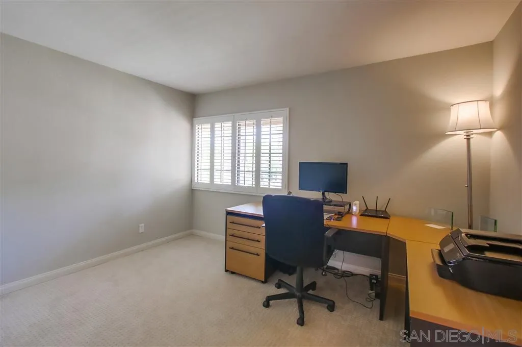 14032 Old Station Road Poway, CA 92064 - Photo 21 of 25 a view of a workspace with furniture and a window