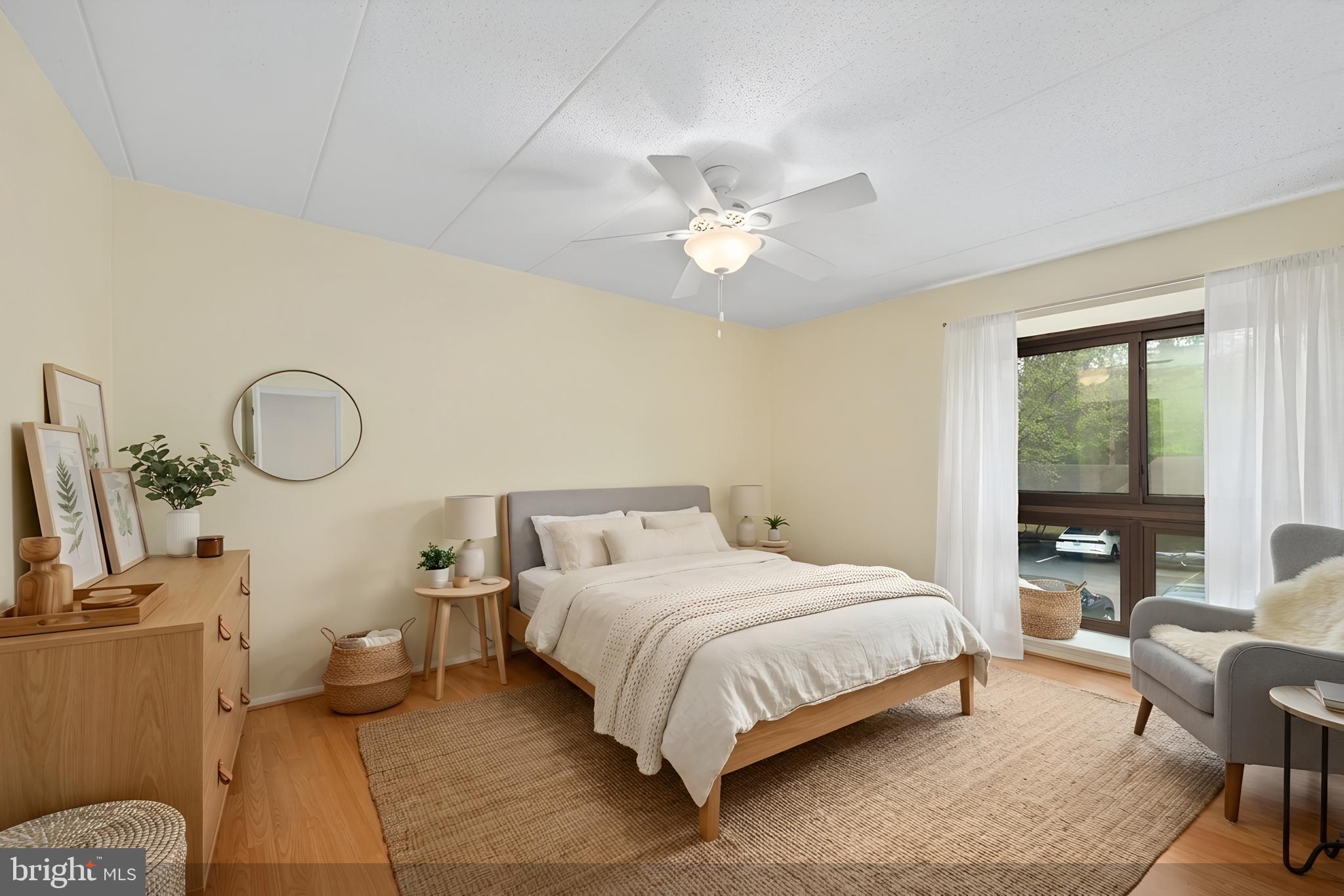 2116 Green Watch Way, Unit 10/201D Reston, VA 20191 - Photo 14 of 32 Serene bedroom with natural light.