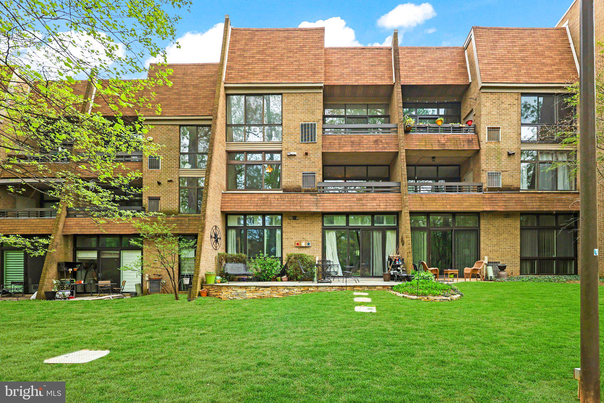 2116 Green Watch Way, Unit 10/201D Reston, VA 20191 - Photo 29 of 32 Charming townhouse with lush greenery.