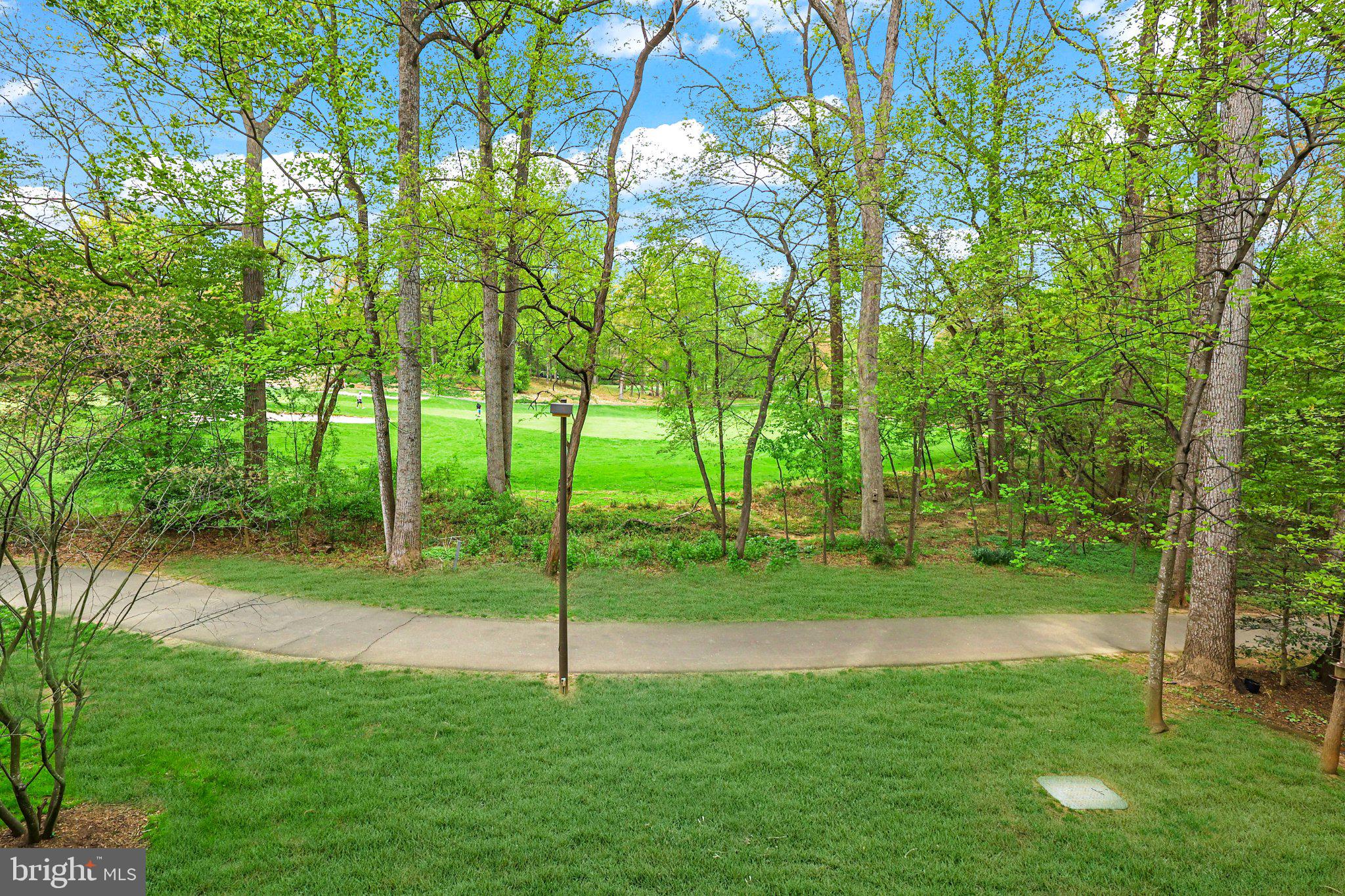 2116 Green Watch Way, Unit 10/201D Reston, VA 20191 - Photo 3 of 32 Serene greens and winding paths await.