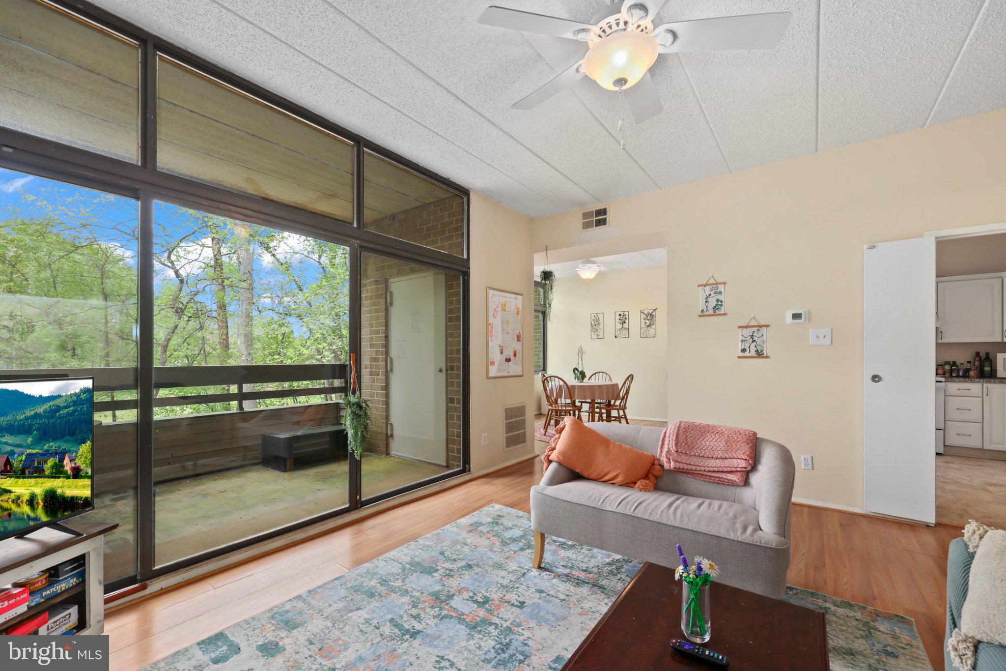 2116 Green Watch Way, Unit 10/201D Reston, VA 20191 - Photo 8 of 32 Bright and airy retreat with nature views.