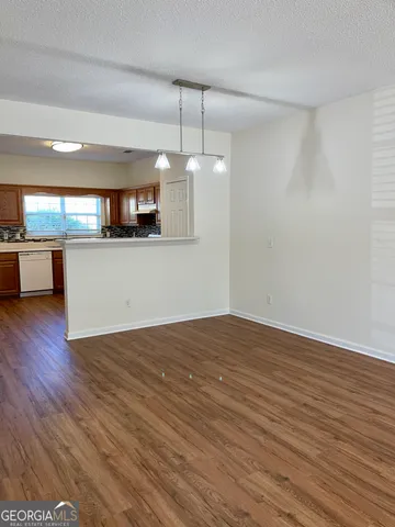 a view of a kitchen with a sink and microwave