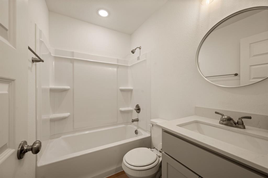 4096 Merida Avenue Fort Worth, TX 76110 - Photo 11 of 17 a bathroom with a sink toilet and a bathtub