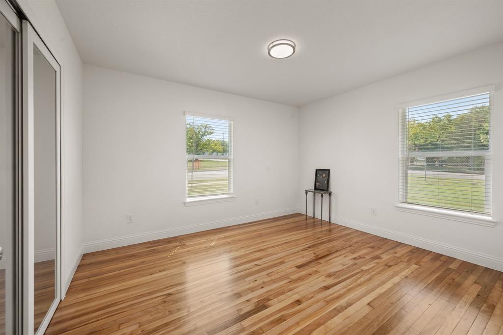 4096 Merida Avenue Fort Worth, TX 76110 - Photo 10 of 17 a bedroom with a bed and a window